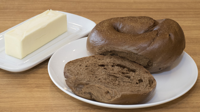 Pumpernickel bagel with butter dish