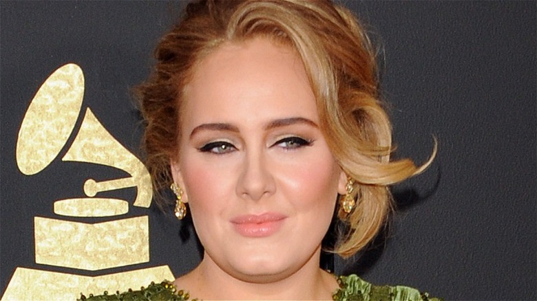 Adele grimacing slightly