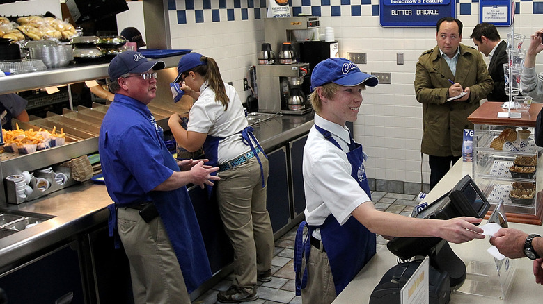 Culver's employees working behind register