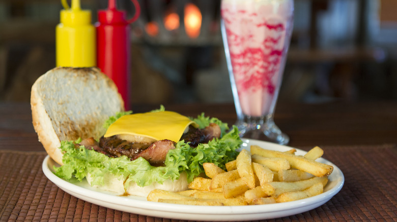 A burger, fries, and a milkshake