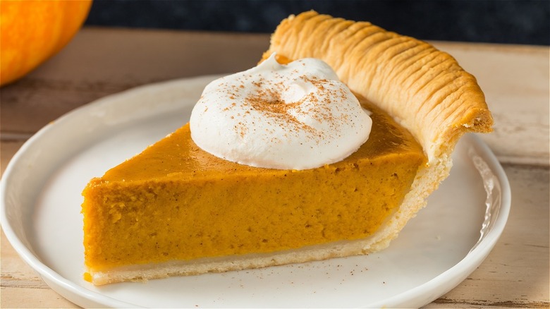 Pumpkin pie with whipped cream