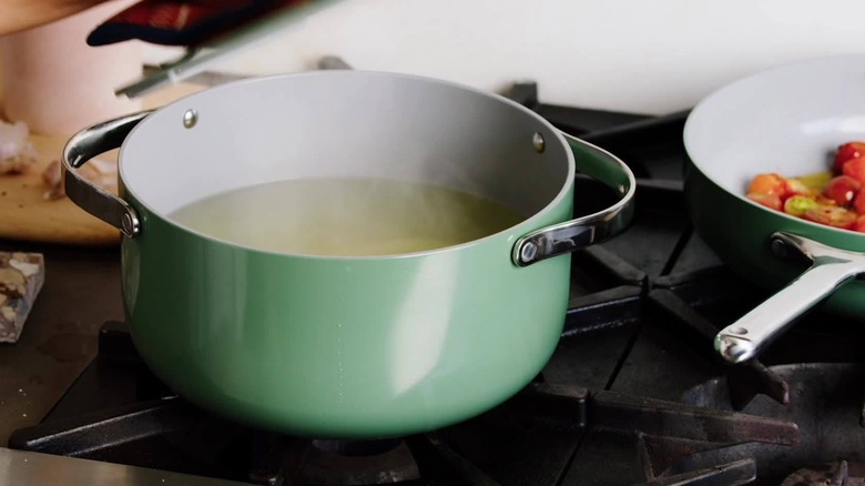 Caraway cookware with broth simmering on the stove
