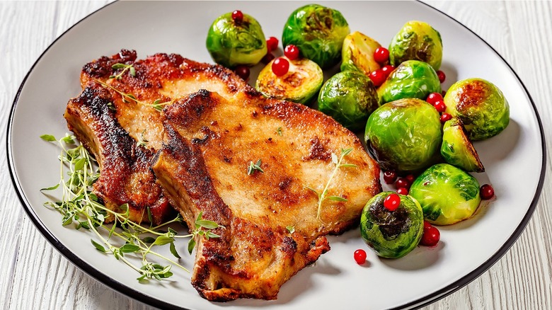 Cooked pork chop with Brussels sprouts