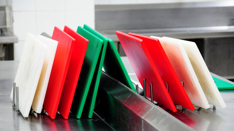 cutting boards stacked in commercial kitchen