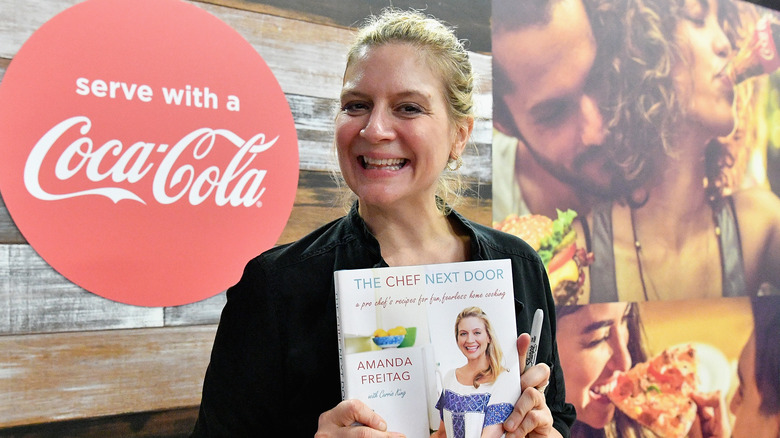 Amanda Freitag holds her cook book