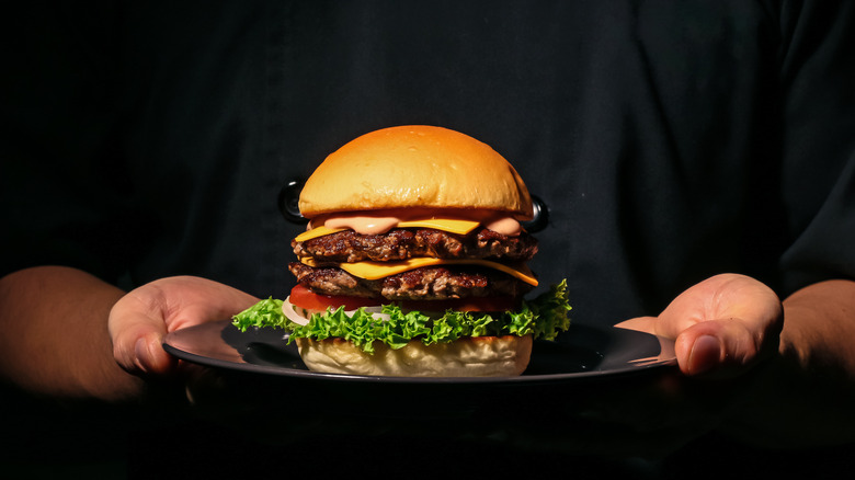 server offering hamburger