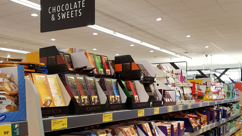 Packages of Moser Roth chocolates on Aldi shelf.