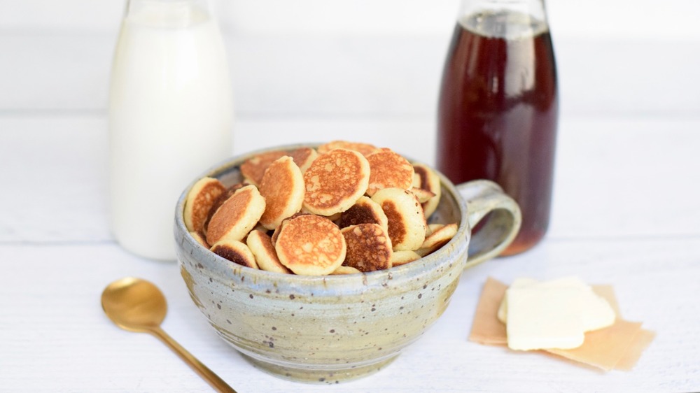 cereal pancakes with syrup and milk