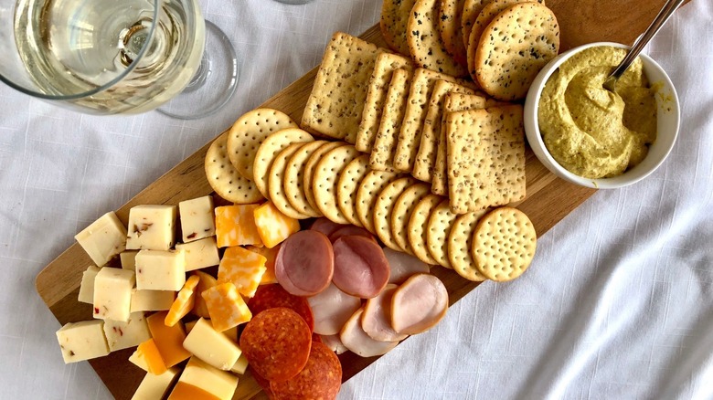 Charcuterie board with cheese, meat, and fruit