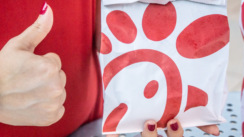 thumbs up with Chick-fil-A bag