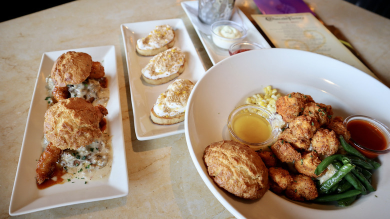 Plates and bowls of food on table
