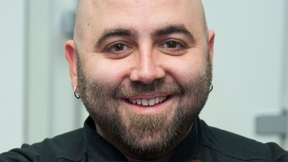 Closeup of Duff Goldman smiling and wearing earrings