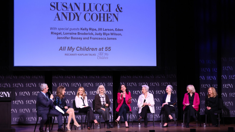 Cast members of the daytime soap, "All My Children" sitting onstage with Susan Lucci and Andy Cohen