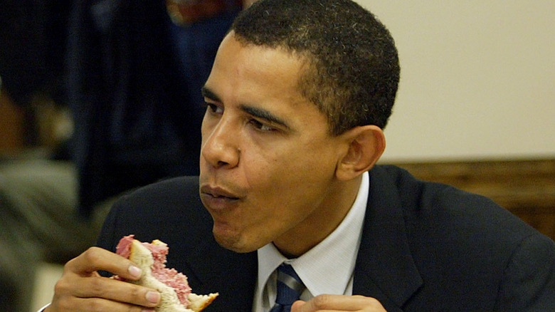 Barack Obama eating a sandwich