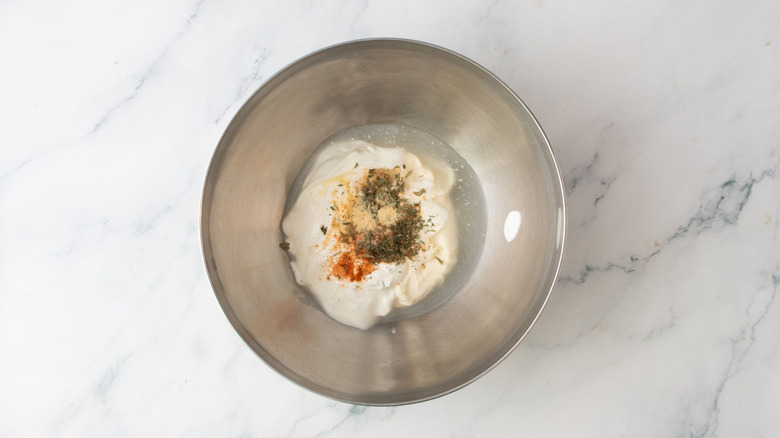 Unmixed ranch dressing ingredients in bowl