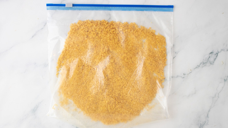Crushed Dorito crumbs in plastic bag