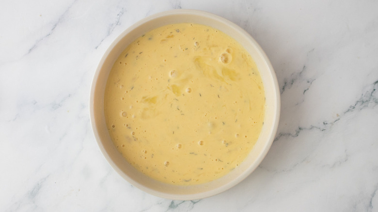 Beaten egg and ranch mixture in bowl