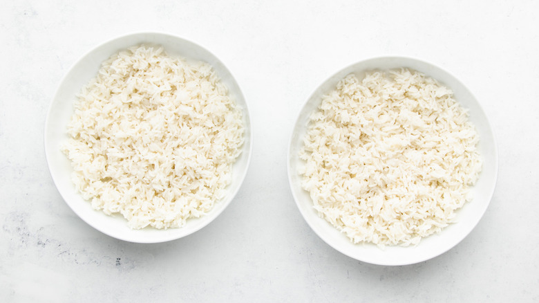 Two bowls of cooked white rice