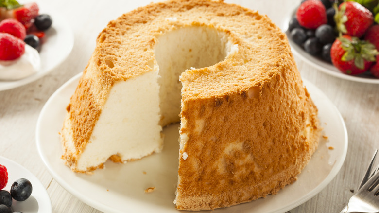 Angel Food Cake on a cake plate with a slice cut out