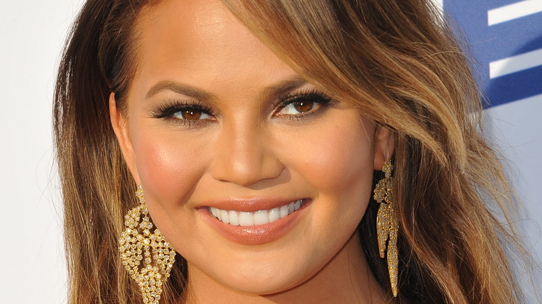 Chrissy Teigen with long earrings 