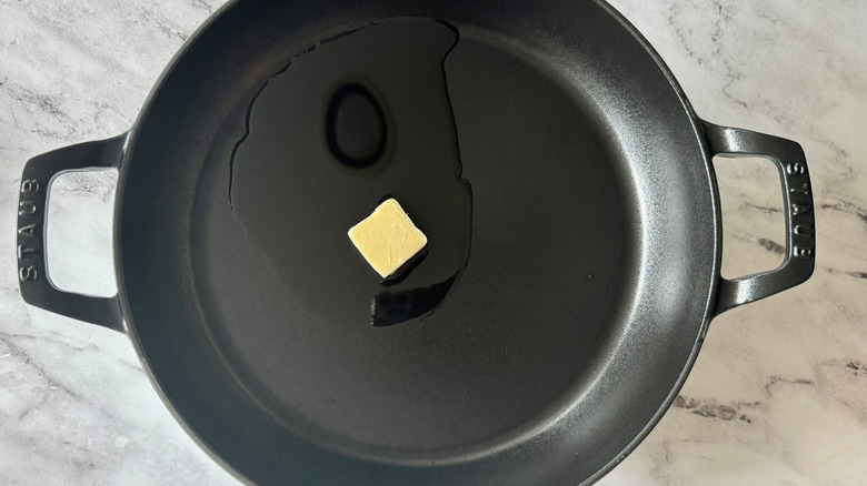 butter and oil in a black pan