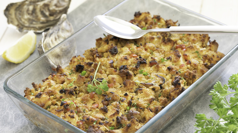 Oyster dressing in a glass casserole dish