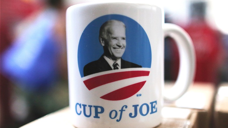 coffee mug with picture of Joe Biden reading CUP of JOE