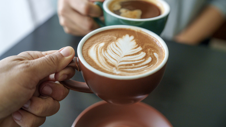 Cappucino and americano in mugs