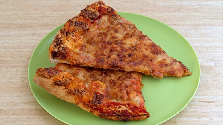 Cold pizza slices on plate