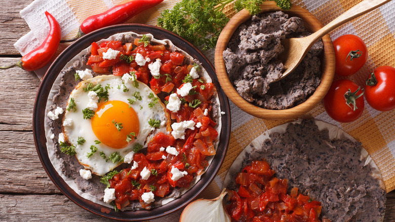 Mexican dish of huevos rancheros with salsa