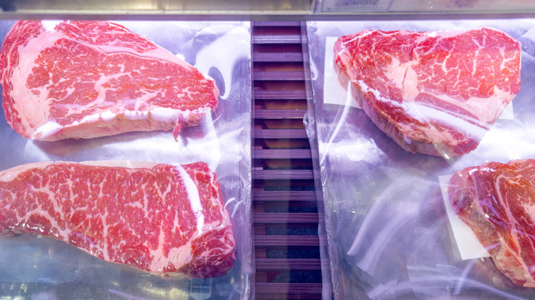 Meat in display case at grocery store