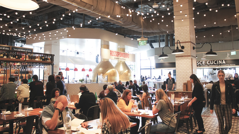 people eating in a food hall