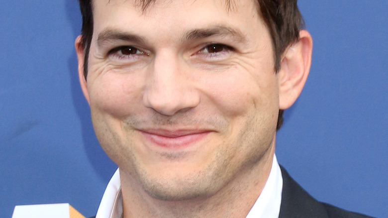 Ashton Kutcher with slight smile