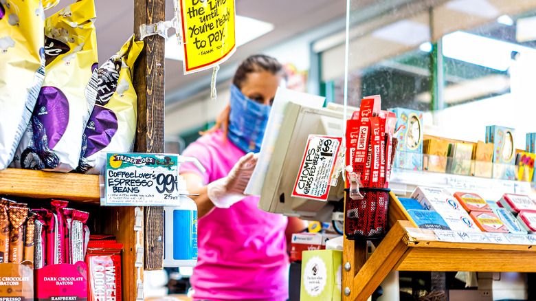 Trader Joe's employee behind checkout counter