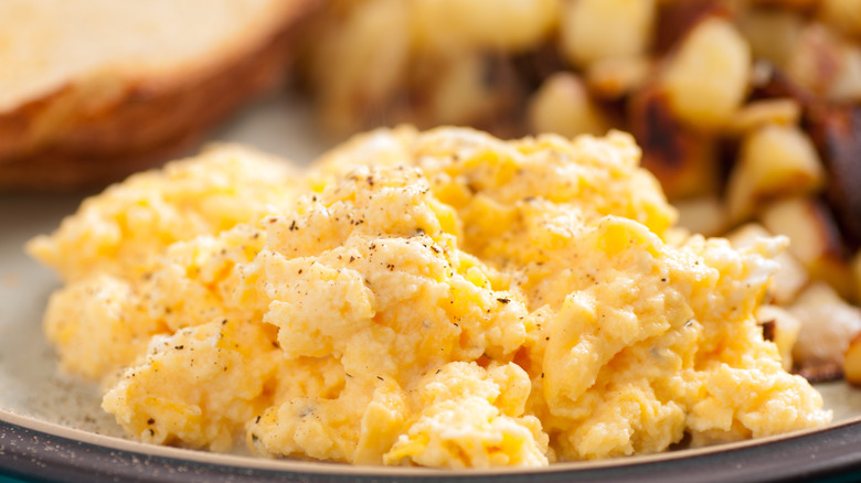 scrambled eggs and hashed potatoes