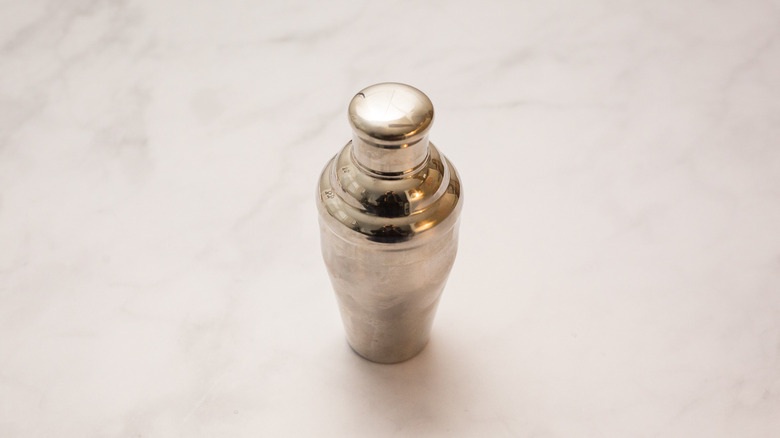 closed cocktail shaker on table