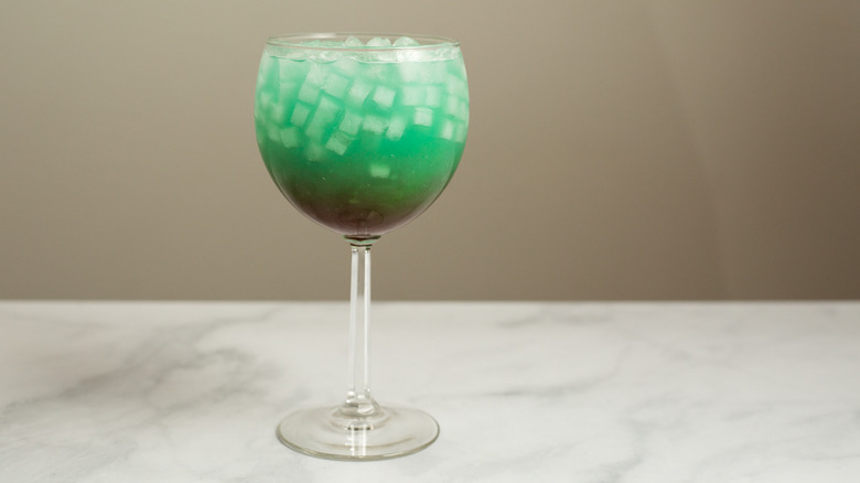 turquoise cocktail on marble table