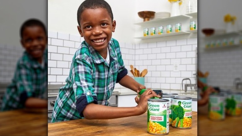 The corn kid opening a can of corn