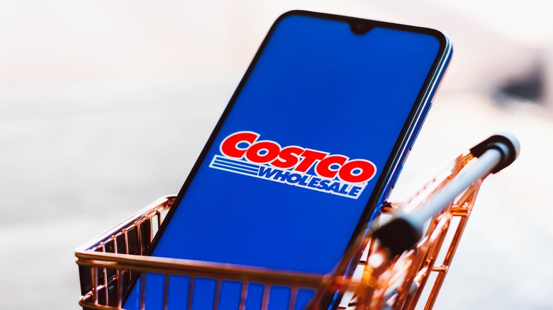 Costco logo on phone in small cart