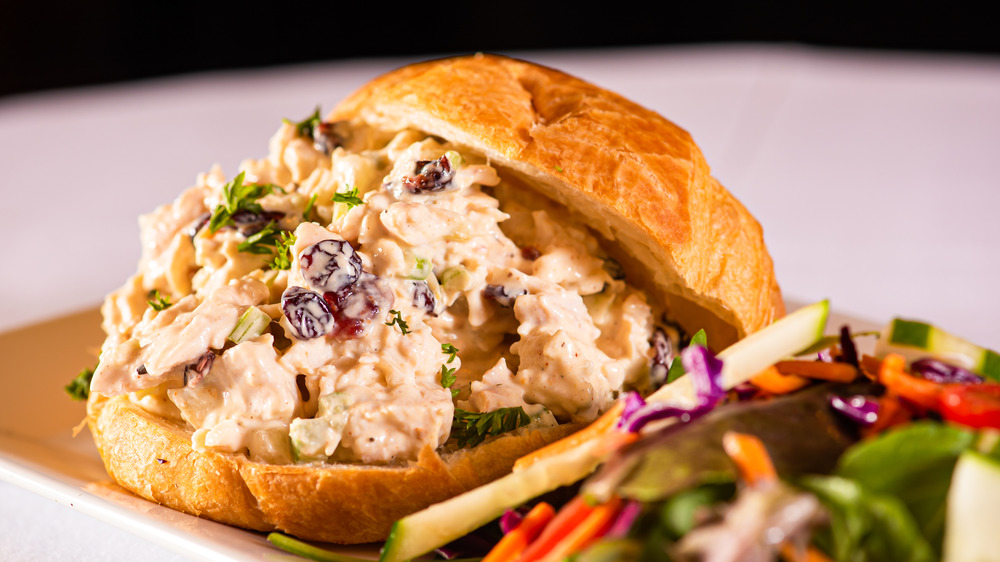 Chicken salad on a croissant with salad