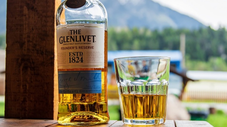 A bottle and glass of The Glenlivet Scotch whisky