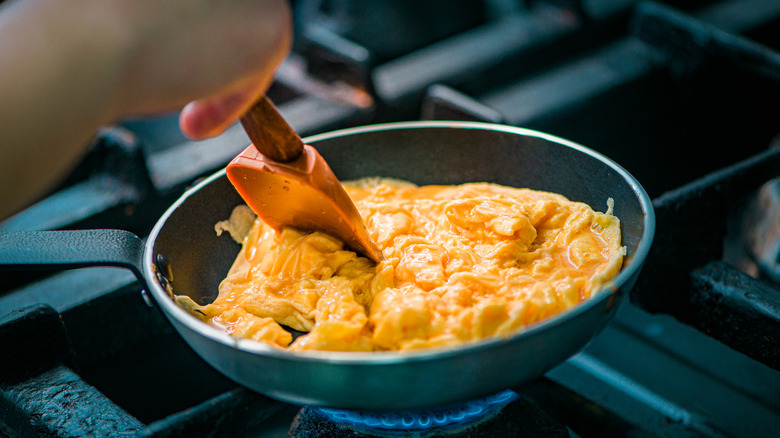 Scrambled eggs being prepared