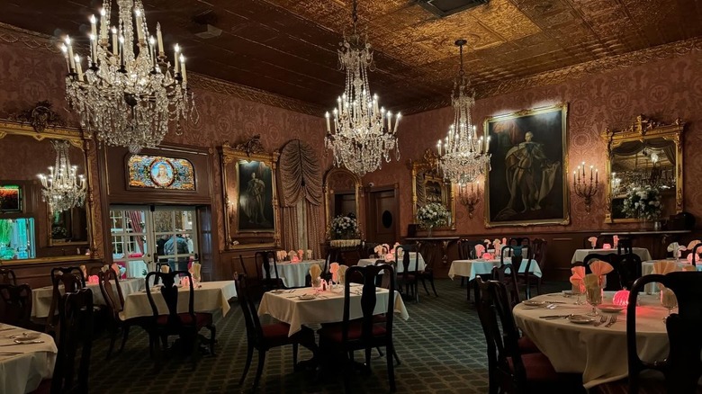 A dining room with chandeliers at Double Eagle