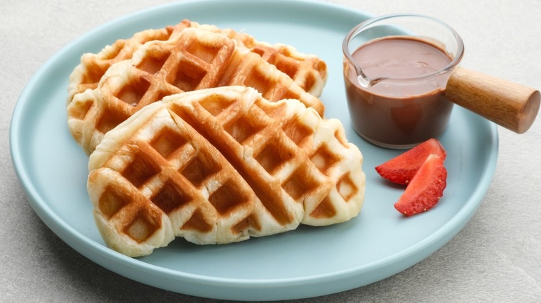 A croffle with chocolate and strawberries