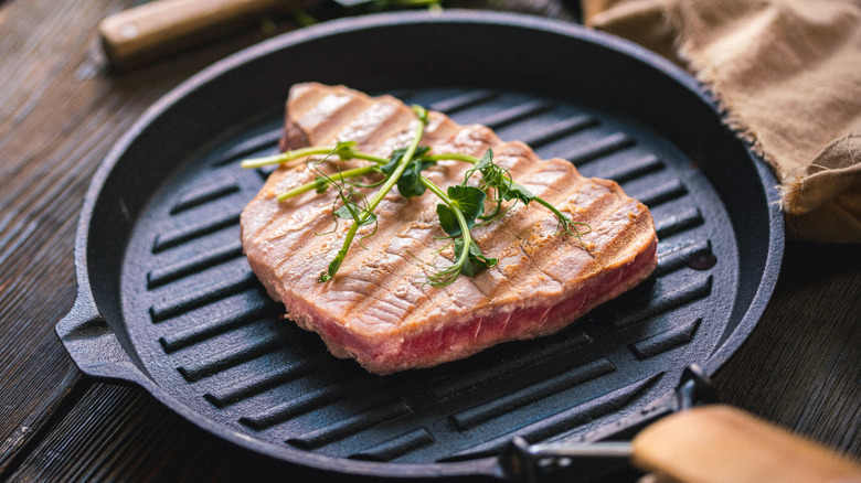 Seared tuna steak in skillet