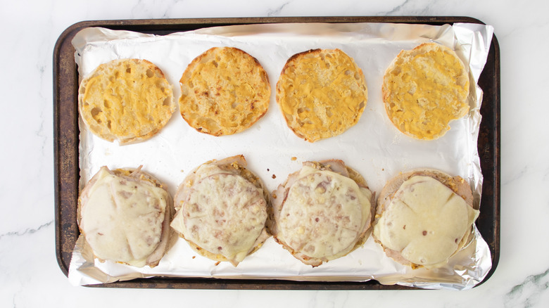 english muffin halves with broiled cheese