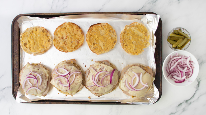 cuban-style breakfast sandwich halves garnished with onions