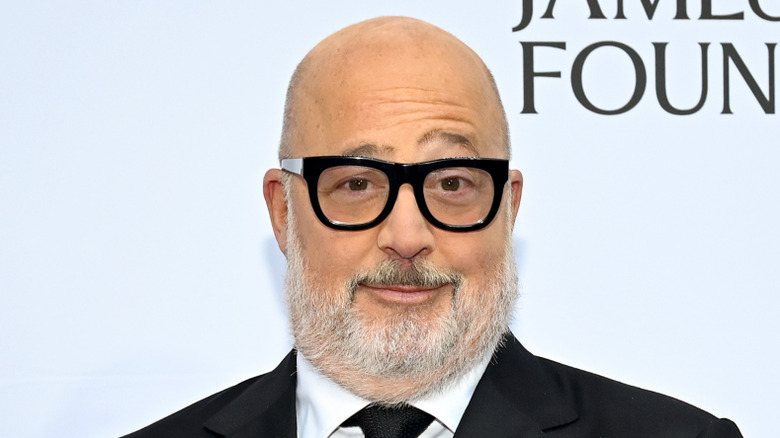 Andrew Zimmern smirking for cameras at publicity event