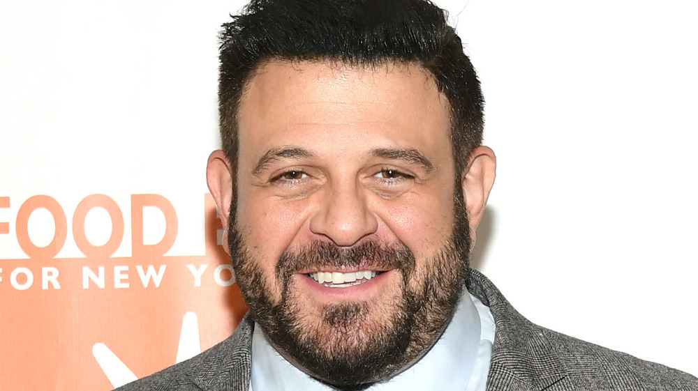 Adam Richman smiling at event