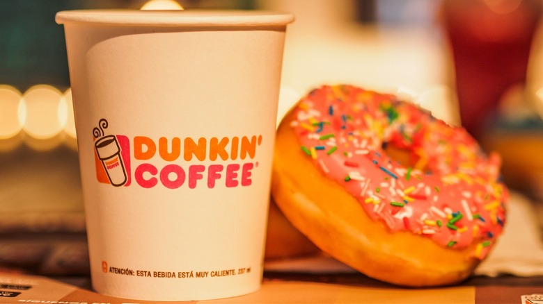 A cup of coffee and a donut from Dunkin'